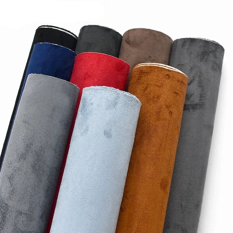 Rolls of fabric in various colors with MEETEE branding on a white background